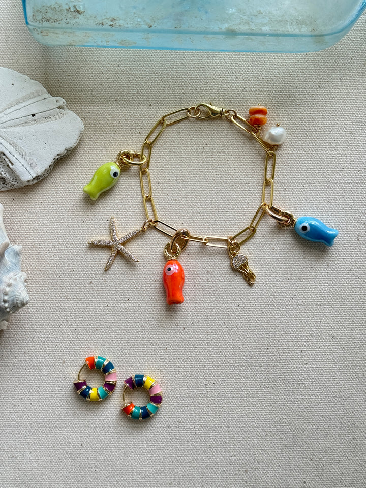 Gold bracelet with colorful fish, octopus and starfish charms 